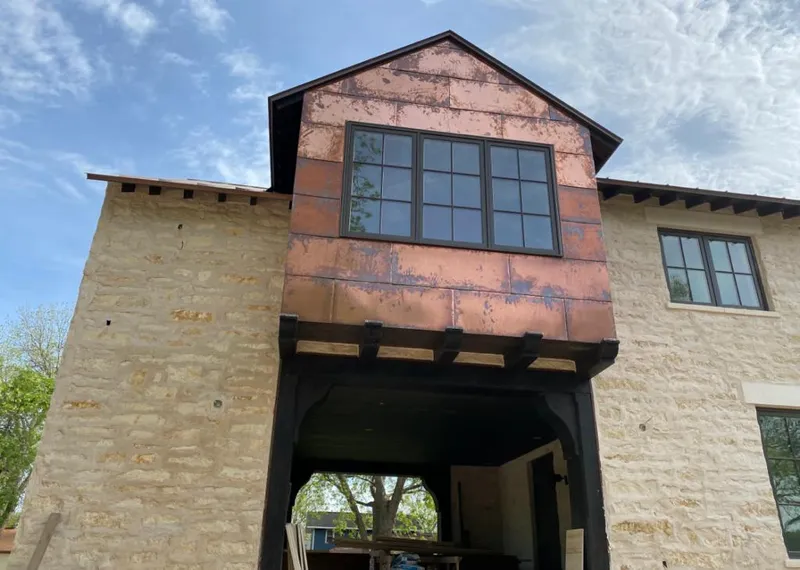 Copper metal panel facade on a stone building for Metal Roof Coating in Potomac